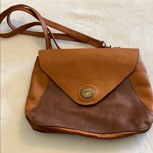 Tan leather crossbody purse by Land.